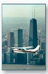 Cessna 210 Flying by the John Hancock Building in Chicago